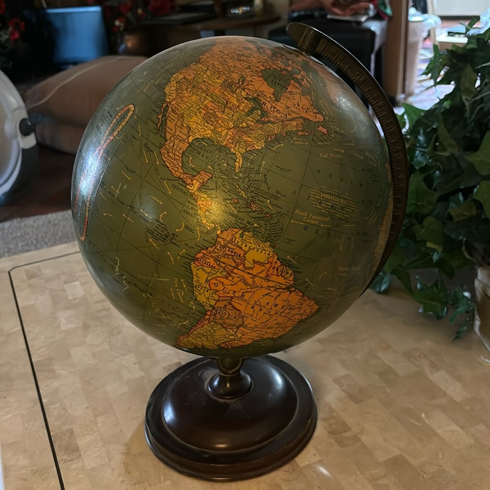 Antique world globe in perfect condition.. wood base   17” tall. C 39” around